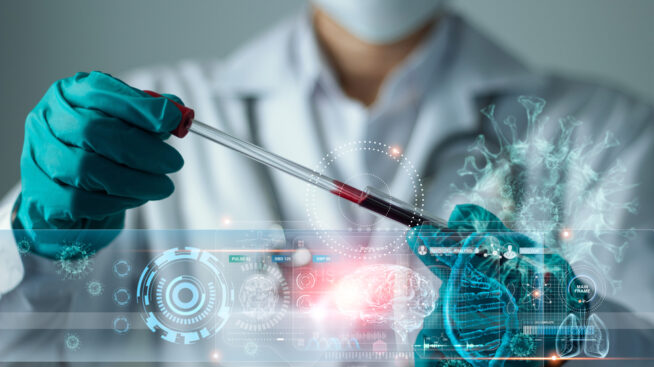 Researcher with vial of blood